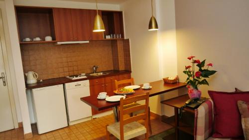 a small kitchen with a table and a dining room at TALEN OTEL in Istanbul