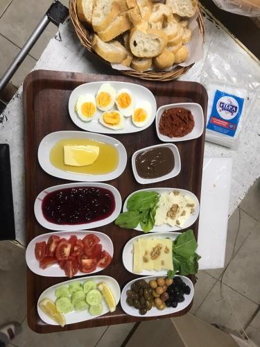 a tray of different types of food on a table at La Bella Suit Otel in Kusadası
