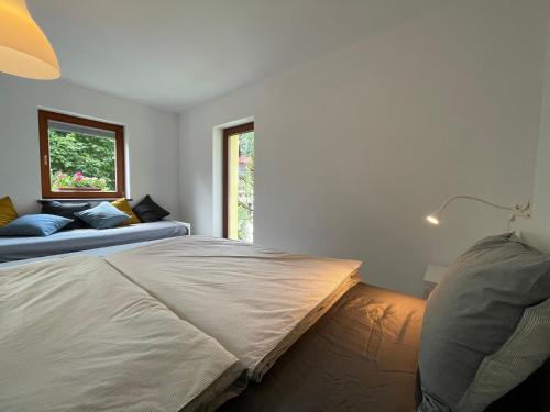 Un ou plusieurs lits dans un hébergement de l'établissement Apartma 7 - In the heart of Soča Valley