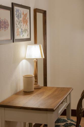 a table with a lamp on top of it at Villa Sant'Angelo in Alba Adriatica