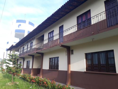 a building with balconies on the side of it at Hotel Araruna in Soure