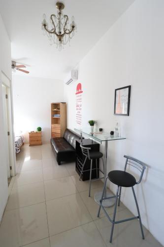 a living room with a table and a couch at Departamento Asturias in La Paz