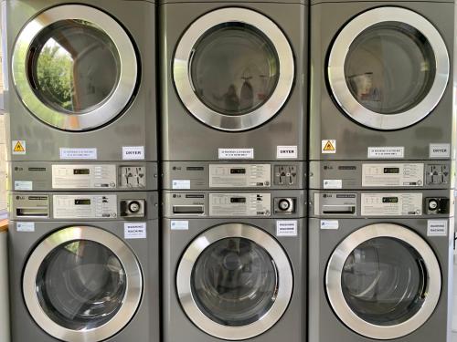 a group of four washing machines in a row at Omarama TOP10 Holiday Park in Omarama