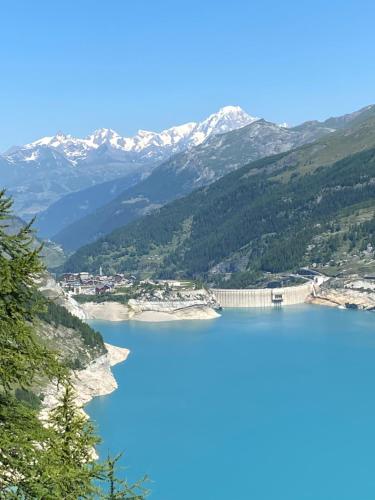 a view of a lake with mountains in the background at Val Claret, Tignes T2 tout confort de 36m2 in Tignes