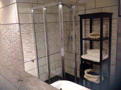 a bathroom with a shower and a toilet at Pescara Center Apartment in Pescara