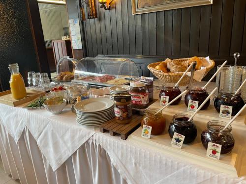 a table with a buffet of food on it at Hotel Regina in Ludwigshafen am Rhein
