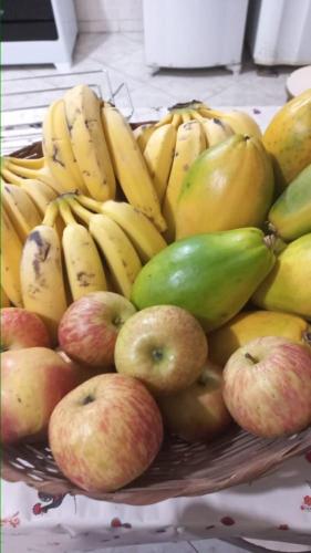 a basket of apples and bananas and other fruits at Ipanema Club Hostel in Rio de Janeiro