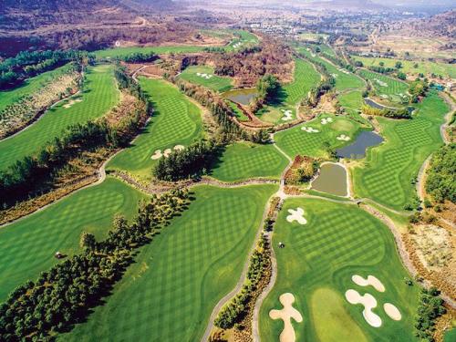 an aerial view of a golf course at Oxford Golf Resort in Pune