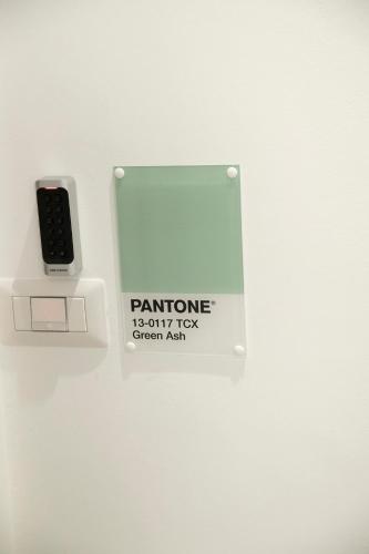 a sign with a remote control on a wall at Marigold Residence in Roseto degli Abruzzi