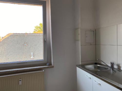 a kitchen with a sink and a window at NEW beautiful place in the village near Leipzig in Elsteraue