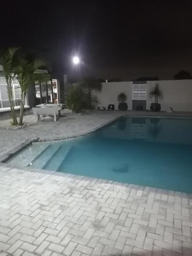 an empty swimming pool at night with a light at 420 on Cape in Port Elizabeth