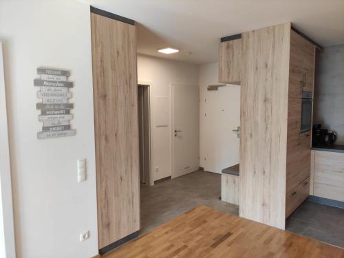 a hallway with wooden dividers in a room at Sonnendorf Öblarn in Öblarn