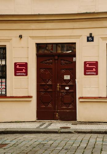 a large wooden door on a building at Safestay Prague Charles Bridge in Prague