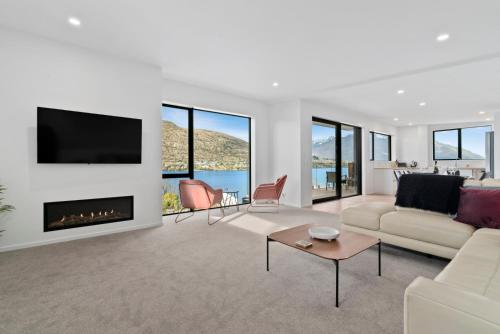 A television and/or entertainment center at Lakeside Bliss - Queenstown Holiday Home