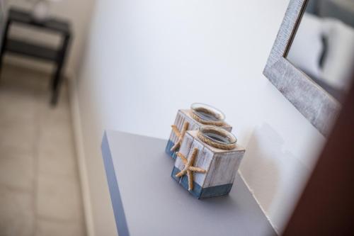 a pair of rings sitting on top of a table at Economisa Apartments in Ialyssos