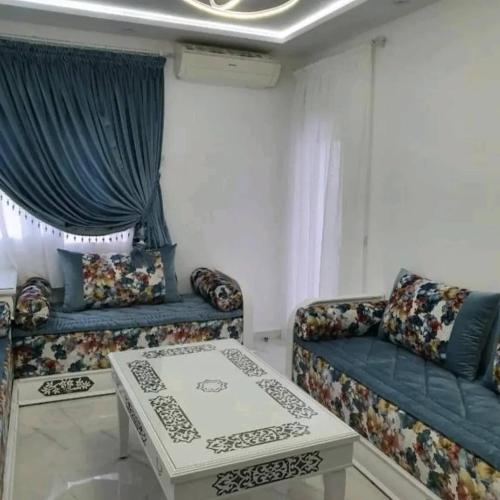 a living room with a couch and a table at Apartamento Marina Smir in Tetouan