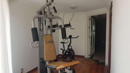 a gym with a bike in a room at Best Western Toluca in Toluca