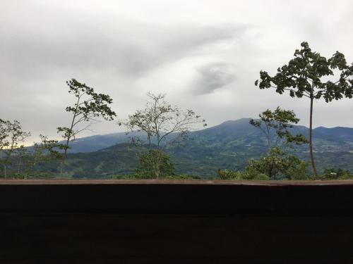 a view of the mountains from a window at Bella Vista Ranch Ecolodge in Turrialba