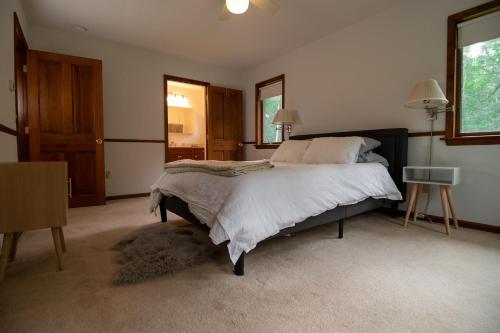 a bedroom with a large bed and a window at Summer and Fall in Sheffield with Monthly Special Pricing Available in Sheffield