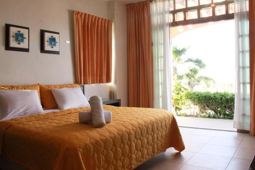 Tempat tidur dalam kamar di Villa Isla Dorada