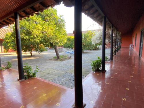 an outside view of a porch of a building at Casona Lo Aguirre , Hospedaje de Temporada Cálidas in Talagante