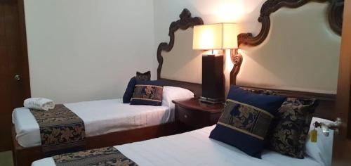 Cama o camas de una habitación en Hotel Mina Vetagrande