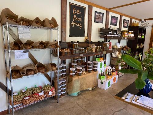 a bakery with breads and other items on display at Mirradong Cottage in Berambing