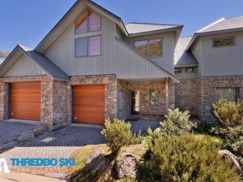 a house with a garage at Ice Chalet 2 in Thredbo