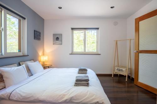 Postel nebo postele na pokoji v ubytování Forest Hideaway