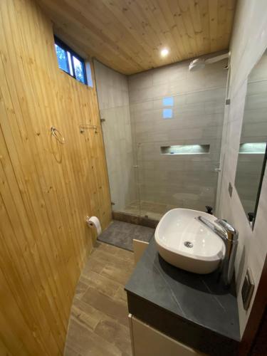a bathroom with a sink and a shower at Glamping/BBQ Susa Cun in Susa