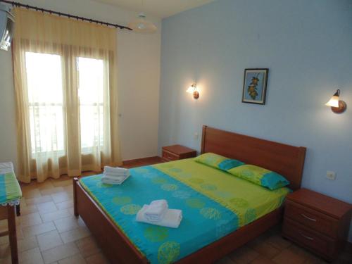 Postel nebo postele na pokoji v ubytování House Evristhenis 1
