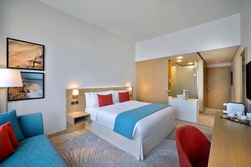 Letto o letti in una camera di Avani Ibn Battuta Dubai Hotel