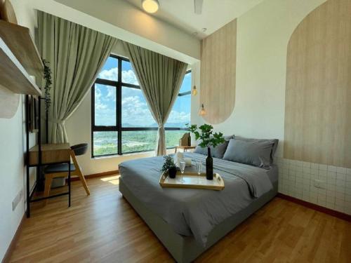 a bedroom with a bed and a large window at Kuantan Imperium by Glex in Kuantan