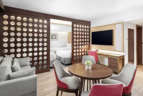 a living room with a couch and a table at Makarem Ajyad Makkah Hotel in Makkah