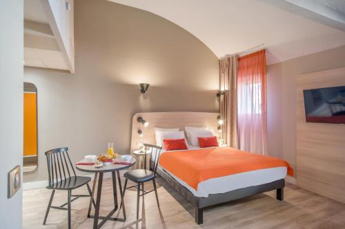 En eller flere senger på et rom på Appart'City Confort Montpellier Saint Roch