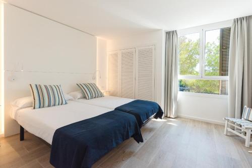 Кровать или кровати в номере Apartamento Ferrera Park 307