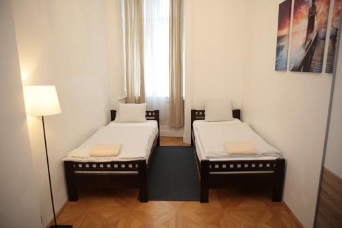 A bed or beds in a room at Heart of Vienna- next to Albertina