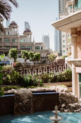 a swimming pool in the middle of a city at Swissôtel Al Murooj Dubai in Dubai