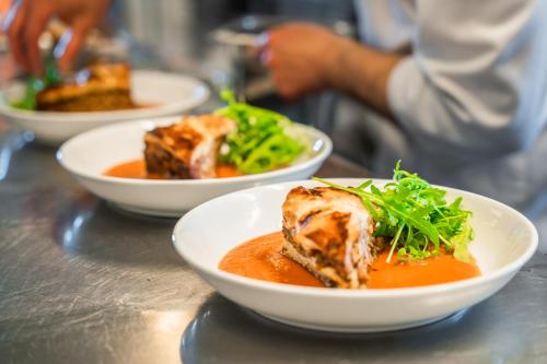 a table with three bowls of food on a table at Hustadvika Havhotell - by Classic Norway Hotels in Farstad