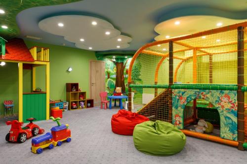 a childs play room with toys and a cage at Garden Street Hotel in Saint Petersburg