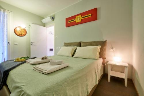 A bed or beds in a room at Il SOLE HOUSE