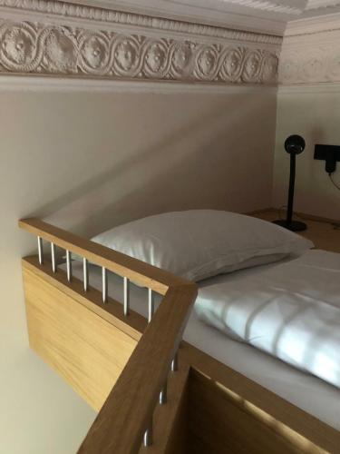 a bedroom with a bunk bed with a wooden frame at stilwerk Hotel Heimhude in Hamburg