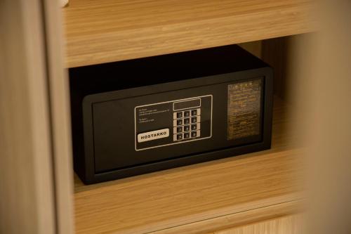 a microwave oven in a drawer of a cabinet at Pearl River Hotel in Hai Phong