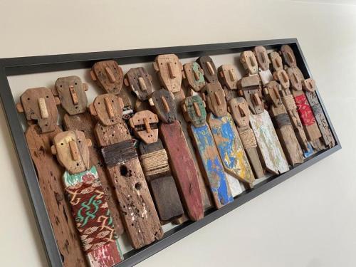 a group of wooden collars on a shelf at The Hive at Poppi-Red in Hawkshead