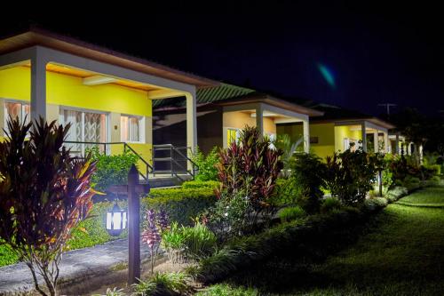a house at night with a garden in front of it at Andasibe Lemurs Lodge in Andasibe