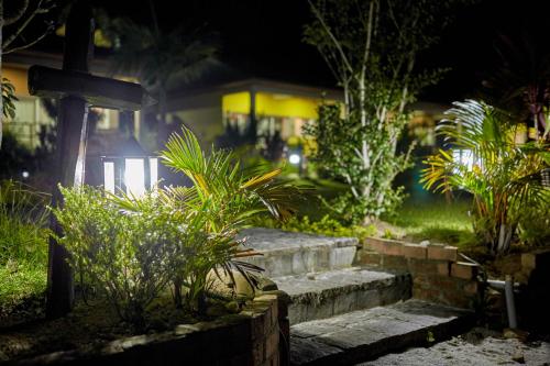 a set of stairs in front of a house at night at Andasibe Lemurs Lodge in Andasibe