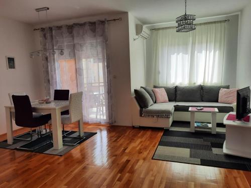 a living room with a couch and a table at Apartman Natasha in Trebinje