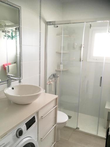 a bathroom with a shower and a sink and a toilet at El Puertito by TOR in Teguise