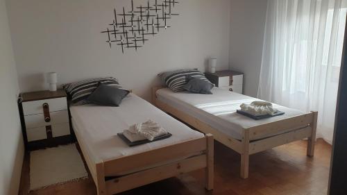 Postel nebo postele na pokoji v ubytování Apartman Lusi