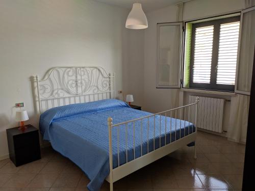 Posteľ alebo postele v izbe v ubytovaní Residenza Silvestro a 2 minuti dalla fiera e dal mare!